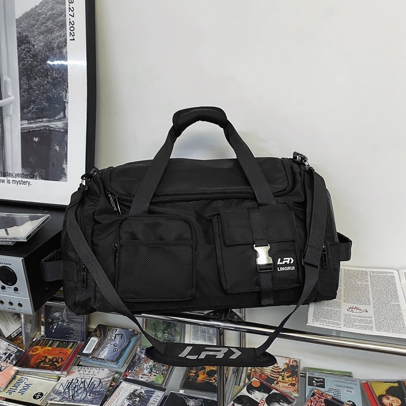 Black Unisex Travel Bag with Utility Buckles and Wet/Dry Compartments